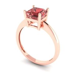 a rose gold ring with a square cut pink tourmaline stone in the center