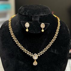 Description: This yellow gold color CZ necklace and matching earrings are lightweight and made with the highest quality craftsmanship. They are a stunning addition to any outfit and will make a perfect gift for any occasion. Inter Changeable   pear shape earrings and pendant with different colors Features: Crystal stones Lightweight and elegant Can be paired with any dress, kurti, or saree Material: Pearl dropping Cubic Zirconia (CZ) Stones Solitaire Necklace Ready to ship from California Free U Yellow Gold Plated Jewelry Sets For Formal Occasions, Festive Yellow Gold Jewelry Sets With Matching Earrings, Festive Gold Diamond Necklace For Wedding, Elegant Yellow Diamond Necklace For Gift, Elegant Yellow Diamond Necklace Gift, Formal Yellow Gold-plated Jewelry Sets, Gold Kundan Diamond Necklace For Festive Occasions, Gold Diamond Jewelry Sets With Earrings, Gold Diamond Jewelry Set With Matching Earrings