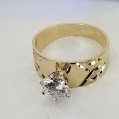 Beautiful engagement ring in 14k gold with a diamond cut zirconia stone design. Ring size is adjustable, please note the size in the personalizing section of checkout. The ring is 1 mm thick. Dazzling 14k Gold Rings With Vvs Clarity, 14k Gold Brilliant Cut Diamond Promise Ring, Dazzling 14k Gold Promise Ring, White Diamond 14k Gold Promise Ring, 14k Gold Diamond Ring For Promise With Center Stone, Dazzling Yellow Gold Promise Ring, Promise Solitaire Ring With White Topaz, Promise Ring With Brilliant Cut In 14k Gold, 14k Gold Diamond White Princess Cut Ring