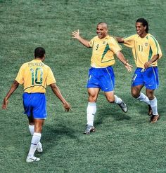 the soccer players are celebrating on the field