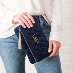 This Personalized Fold Over Velvet Clutch Crafted from luxe velvet, this clutch folds over to make it compact and easy to carry.  The Custom Monogrammed Embroidered Velvet Clutch Bag is crafted from chic, luxe, soft Velvet in Navy Blue, Blush Pink, or Emerald Green. The single pouch fold-over clutch has a top zip closure with a cute gold tassel, and two magnetic snaps to maintain the attractive straight line fold. Its single, large zip pocket the perfect size to hold your wallet and cell phone a Embroidered Clutch Bag, Wedding Sweatshirts, Velvet Clutch, Embroidered Clutch, Bleu Pastel, Rose Blush, Rose Pastel, Straight Line, Personalized Embroidered