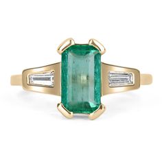 Featured is a stunning Colombian emerald and diamond, three-stone ring. A full 1.90-carats of pure, natural, Colombian beauty! This emerald displays a gorgeous, spring green color, with excellent eye clarity. On either side of this beauty, are tapered baguette accents that are bezel set. This unique ring was crafted in gleaming, 14K yellow gold. Setting Style: Three-Stone / Prong-Bezel Setting Material: 14K Yellow Gold Gold Weight: 3.1 Grams Main Stone: Emerald Shape: Emerald Cut Weight: 1.90-Ca Spring Green Color, Diamond Three Stone Ring, Baguette Diamond Ring, Baguette Diamond Rings, Three Stone Ring, Colombian Emeralds, Unique Ring, 14k Gold Ring, Three Stone Rings