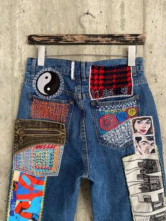 "Ready to send:size- 28 unique vintage jeans one of a kind.. hand made embroidery and unique patches. ---Or---- Made to order, in any size, within 12 working days . If you need different size, please send me a message and I will make you a special and unique design within 12 working days. They are all different! No one will have the same one as you have! Hand painted, one of kind jeans. You pick your size, model (slime- boyfriend- high waist- low waist) and primer color and you will get your sin Multicolor Denim Bottoms With Patches, Blue Denim Pants For Festival, Retro Cotton Jeans With Graphic Print, Upcycled Denim Blue Straight Leg Bottoms, Upcycled Straight Leg Denim Bottoms, Retro Denim Patchwork Pants, Retro Patchwork Jeans For Streetwear, Retro Patchwork Denim Pants, Retro Wide Leg Patchwork Jeans