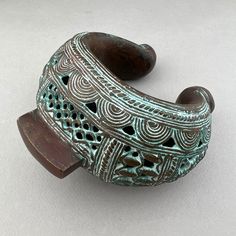 "A stunning piece of complex copper alloy casting made by the Bamum People of Camerron in the early 1900's. A prestige item and store of wealth - currency. A wonderful example of ethnographic art that would look fabulous on a book shelf of table. 5\" by 5 1/2\" Heavy" Traditional Cuff Bracelet With Patina As Gift, Traditional Bronze Bracelets For Ceremonial Use, Traditional Bronze Bracelets For Ceremonial Occasions, Traditional Bronze Cuff Bracelet For Ceremonial Occasion, Bronze Antique Finish Bracelets For Ceremonial Occasion, Traditional Patina Cuff Bracelet As Gift, Traditional Bronze Cuff Bangle Bracelet, Traditional Bronze Cuff Bracelet, Traditional Bronze Jewelry With Patina