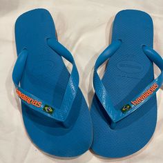 Brand New Beautiful Blue And Orange Flip Flops. Great For The Pool! Mens 9 Women’s 11 Really Unisex Blue Sporty Flip Flops For Vacation, Sporty Blue Flip Flops For Vacation, Blue Slip-on Casual Flip Flops, Blue Casual Slip-on Flip Flops, Casual Blue Slip-on Flip Flops, Casual Blue Flip Flops, Sporty Blue Flip Flops For Beach, Sporty Blue Flip Flops For The Beach, Orange Flat Flip Flops Casual Style