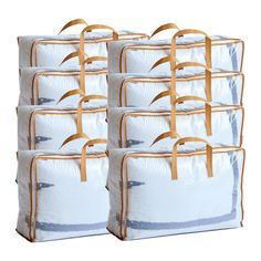 six white bags with brown handles are stacked on top of each other in front of a white background