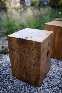 two wooden blocks sitting on top of gravel