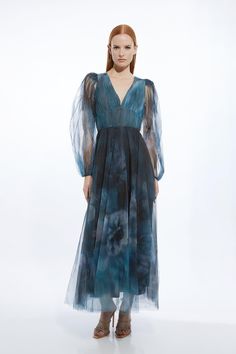 Prepare To Turn Heads In Our Mini Dress, Designed To Make A Statement. It Features A Deep V Neckline And A Universally Flattering Fit And Flare Silhouette, While Sheer Balloon Sleeves Offer An Ethereal Element. Complete With A Full Skirt At A Mini Length, This Style Cinches In At The Waist, Balancing The Figure And Making It Easy To Style. Blurred Floral Tulle Plunge Maxi Dress Premium Tulle Fabric Figure-Fitting Waist Lightweight Sheer Fabric  Plunge Neckline V Back Accent Voluminous Balloon Sl Bride Jumpsuit, Petite Wedding Guest Dresses, Latest Maxi Dresses, Plunge Maxi Dress, Summer Bridesmaid Dresses, Maxi Dress Collection, Outfits Petite, Plunge Neckline, Wedding Guest Dress Summer