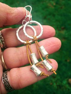 This gorgeous pair of earrings feature hand-rolled silver beads strung in natural mustard yellow leather cords and Hill Tribe silver rings and sterling silver hooks.  The silver is bright and shiny at the moment but as is the case with silver, with exposure to the atmosphere, it will obtain a lovely patina and the embossed patterns will be highlighted over time. If you do not like the patina, it can always be polished back to it's bright and shiny self. The earrings are approx. 3 inches long and approx. 1 inch wide at the widest point.  Free shipping within USA. -------------- Sterling Silver Hoop Earrings, Dangle Earrings, Boho Earrings, Delicate Earrings, Statement Earrings, Long Silver Earrings, Leather Earrings Nickel-free Dangle Wrap Earrings, Everyday Nickel-free Dangle Wrap Earrings, Adjustable Dangle Wrap Earrings For Jewelry Making, Adjustable Nickel-free Dangle Wrap Earrings, Sterling Silver Linear Earrings With Dangling Beads For Gift, Artisan Sterling Silver Jewelry With Dangling Beads, Everyday Small Hoop Jewelry With Dangling Beads, Bohemian Silver Dangle Wrap Earrings, Silver Sterling Hoop Earrings With Dangling Beads