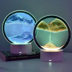 two illuminated objects sitting on top of a table