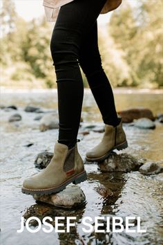 Woman with black jeans wears olive colored Chelsea pull-on boots as she scales rocks in a stream. Lightweight Boots, Rugged Look, Cold Day, Moccasins, Womens Boots, Chelsea, Leather Upper, Elastic, Zipper