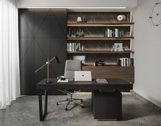 a desk with a laptop on it in front of a bookshelf