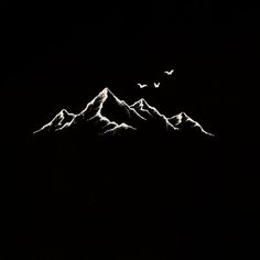 two birds flying over the top of a mountain range at night with snow covered mountains in the background