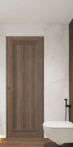 a white bath tub sitting next to a wooden door