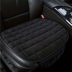 the interior of a car with black leather seats and an electronic device in it's center console