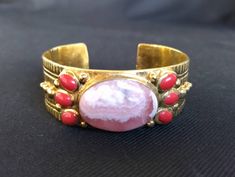 Lovely vintage bracelet Gold tone metal with color semi precious stones Great quality and great condition I combine shipping! Antique Multi-stone Bracelet As Gift, Antique Multi-stone Bracelets As Gift, Bohemian Oval Gemstone Cuff Bracelet, Collectible Gemstone Bangle Bracelets, Vintage Red Gemstone Bracelets, Vintage Oval Multi-stone Bracelets, Vintage Cuff Bracelet With Natural Stones, Vintage Bangle Cuff Bracelet With Natural Stones, Vintage Natural Stones Cuff Bracelet