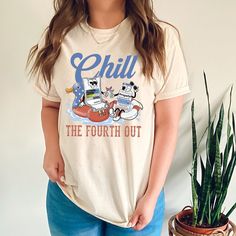 a woman standing next to a potted plant wearing a t - shirt that says chill the fourth out