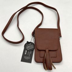 New Condition With Tags K. Carroll Accessories Vegan Leather Removable Strap Use As A Waist Bag Attach To A Belt Or Use As A Crossbody Lightweight Material Decorative Hanging Tassel Bundle & Save Brown Pouch Phone Bag With Pockets, Brown Crossbody Phone Bag With Pockets, Brown Phone Bag For Everyday Use In Fall, Casual Brown Phone Bag With Pockets, Brown Phone Bag For Daily Use In Fall, Brown Phone Bag For Daily Use, Brown Phone Bag For Fall, Brown Phone Bag For Fall Travel, Wizard Of Oz Musical