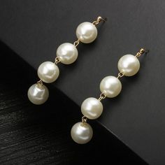 These dangle drop pearl earrings are an elegant and unique accessory, featuring a minimalist design that exudes sophistication. Each earring showcases a lustrous off-white pearl, carefully handcrafted to ensure a perfect finish. The simple yet exquisite design makes these earrings a versatile addition to any jewelry collection. They are a thoughtful and personalized gift, especially ideal for mothers who appreciate timeless beauty and artisanal craftsmanship. The understated elegance of these earrings allows them to be worn for both casual and formal occasions, making them a cherished keepsake for any special moment. Drop Pearl Earrings, Off White Colour, Personalized Gifts For Mom, Understated Elegance, White Colour, Off White Color, Pearl Drop Earrings, Accessories Unique, White Pearl