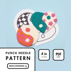 two donuts are sitting on top of each other, with the words punch needle pattern below them