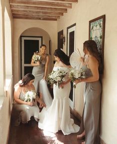 the bridesmaids are getting ready to walk down the aisle