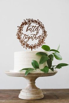 a cake that has some leaves on it and is sitting on top of a table