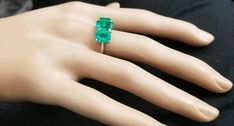 GORGEOUS VINTAGE PLATINUM & 18K GOLD COLOMBIAN EMERALD RING CENTER GEM EMERALD WEIGHS 2.13CARAT SIZE 9X7 mm CENTER GEM EMERALD COLOMBIA BERYL EMERALD GORGEOUS COLOMBIAN EMERALD AAA RATED!! CLEAN ,VERY NICE CUT ,AMAZING BRILLIANCE FULL OF FIRE, side set natural green emerald 2.86ct. size 8x6mm RING size 8 Tremendous old vintage ring in excellent condition Retail value $19,500 net . Appraisal available Formal Three Stone Emerald Ring In Fine Jewelry Style, Formal Three Stone Emerald Ring, Platinum Emerald Three Stone Ring For Anniversary, Platinum Three Stone Emerald Anniversary Ring, Fine Jewelry Emerald Platinum Ring With Three Stones, Classic Three Stone Emerald Ring For Formal Occasions, Platinum Three Stone Emerald Ring, Green Three Stone Platinum Ring, Formal 14k White Gold Three Stone Jewelry