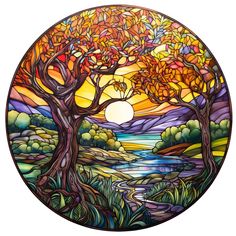 a stained glass window with trees and water