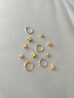 18K gold plated stainless steel, stainless steel. Star charm measures 9 mm x 9 mm. More earrings  https://www.etsy.com/shop/CornerByZ?ref=seller-platform-mcnav If you have any questions, please feel free to contact me. Yellow Gold Huggie With Star Charm, Gold Stainless Steel Jewelry With Star Charm, Dainty Gold Star Charm, Celestial Style Huggie Earrings With Star Charm, Gold Celestial Huggie Earrings For Everyday, Gold Star Huggie Earrings In Celestial Style, Tiny Gold Star Cartilage Earrings, Gold Star Cartilage Earrings Nickel Free, Gold-plated Hoop Earrings With Star Charm