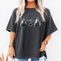 This nature vibes T-shirt is perfect for outdoor lovers who enjoy hiking, camping, and exploring. Featuring mountains, a compass, and a forest design, this shirt exudes wanderlust and adventure. Ideal for those who appreciate the beauty of nature and seek to embrace the great outdoors. Perfect for gifting on birthdays, holidays, and any outdoor occasion. Product features - Available in sizes S to 4XL - Double-needle stitching for durability - Garment-dyed fabric for a soft texture - Made with 10 Graphic Tee For Hiking With Relaxed Fit, Relaxed Fit Screen Print Tops For Outdoor Activities, Black Letter Print Tops For Camping, Black Short Sleeve Top For Camping, Outdoor Short Sleeve Top With Graphic Print, Graphic Print Relaxed Fit Top For Hiking, Graphic Print Short Sleeve Top For Outdoor, Relaxed Fit Graphic Print Top For Hiking, Black Letter Print Top For Outdoor