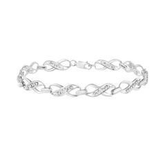 Treat yourself to this elegant and refined infinity link bracelet. Created in cool .925 sterling silver, this piece is designed with silver infinity links with a streak in the middle of round-cut diamonds. This prong set, diamond accent piece is 7.25 inches in length and will be the perfect addition to your jewelry collection. Silver Link Bracelet, Jewelry Safe, Design Silver, Chain Link Bracelet, Bracelet Sizes, Infinity Bracelet, Sterling Silver Bracelets, Link Bracelets, Online Jewelry