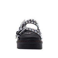 Who knew so much detail could go into one shoe? This beautiful black flat shines brightly in the sun. Glowing beautifully , it's complemented with iridescent pearls tracing the trim. An easy slip-on style make this an easy choice. Vegan leather upper with iridescent pearls accent Man made sole Slip-on styling Platform measures approx. 1.5" H Imported