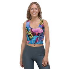 Look fabulous in an all-over printed, body-hugging crop top, now offering FREE SHIPPING to the US, Canada, EU, and UK! The artwork This artwork is a vivid and richly detailed depiction of a variety of African flowers, showcasing a tapestry of vibrant colors and intricate patterns. The piece features a dynamic assortment of floral elements, including large, bold blossoms and delicate foliage, all set against a deep blue background. The use of contrasting colors and stylized forms captures the lus Workspace Essentials, French Collection, African Flowers, Floral Elements, Cropped Tops, Spring Collection, Blue Background, Blue Backgrounds, Deep Blue