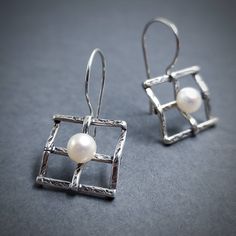 Bridal Pearl Earrings 925. Very elegant geometric earrings made out of Silver 925 and natural freshwater Pearl. You can choose between two different sizes.  If you want to make them a set, here is the matching pendant: https://www.etsy.com/listing/258712074/silver-handmade-pendant-with-pearl?ga_search_query=pendant%2Bsquare&ref=shop_items_search_2&frs=1 Details: Material: Sterling Silver 925 and Pearls 5 mm diameter (0.2 inch) Width: 16mm (5/8 inch) Length: Choose between two options A 35mm (1 3 Modern Pearl Earrings For Gift, Modern Drop Pearl Earrings As Gift, Modern White Gold Pearl Earrings Gift, Modern White Gold Pearl Earrings For Gift, Modern Pearl Earrings With Ear Wire As Gift, Sterling Silver Pearl Earrings Gift, Gift Pearl Earrings In Sterling Silver, Modern Sterling Silver Pearl Earrings For Gift, Modern Sterling Silver Pearl Earrings As Gift