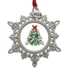 a christmas tree ornament hanging from a red ribbon on a white background with the year 2012 printed on it