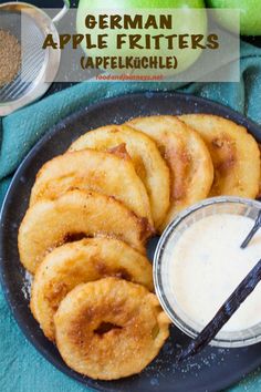 apple fritters are served on a plate with dipping sauce