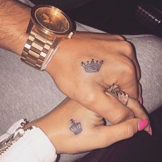 two people with matching tattoos on their hands