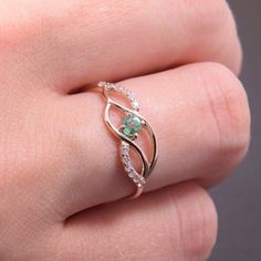 "Emerald ring, Multistone ring, Minimalist ring, Elegant ring, Rose gold ring, Dainty ring, Gemstone ring, Birthstone ring, Gold promise ring WE OFFER UNLIMITED PERIOD INSTALLMENTS PLAN This is a beautiful, stunning, feminine ring that works well for all occasions, styles, and ages. You will love it! Ring information: Main stone: Emerald Approximate size: 3mm Accent stone: Cubic zirconia Metal type: Gold Metal stamp: 14k Gold Customization / Replacements It's easy to create jewelry that's perfec Rose Gold Gemstone Stackable Promise Rings, Delicate Promise Ring With Accent Stones, Rose Gold Birthstone Crystal Ring For Promise, Rose Gold Open Ring For Proposal, Rose Gold Open Diamond Ring For Promise, Rose Gold Crystal Promise Ring, Rose Gold Open Diamond Promise Ring, Delicate Rose Gold Open Birthstone Ring, Dainty Emerald Ring With Accent Stones For Promise