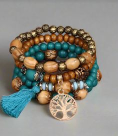 This stylish wood bead bracelet is the perfect way to add a touch of bohemian flair to any look. Crafted from sustainable wood, with a great color scheme, it's sure to complement any outfit. Stylish, eco-friendly, and easy to wear, this bracelet is a must-have for any fashionista. Trendy bracelet made up of beads and charms. Pretty wood with a splash of color thrown in. One size fits all. Weight is 1.3 oz.Free shipping, 9-14 days delivery. Bohemian Blue Beaded Bracelets With Wooden Beads, Blue Bohemian Beaded Bracelets With Wooden Beads, Bohemian Blue Bracelets With Wooden Beads, Bohemian Beaded Bracelets With 8mm Beads, Handmade Natural Wood Beaded Bracelets, Bohemian Turquoise Beaded Bracelets With Wooden Beads, Bohemian Wooden Beads Bangle, Bohemian Bangle With Wooden Beads, Handmade Beaded Wood Bracelets In Natural Wood Color