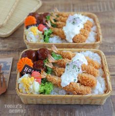 two baskets filled with food on top of a wooden table