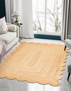 a living room with a large rug on the floor and a chair next to it