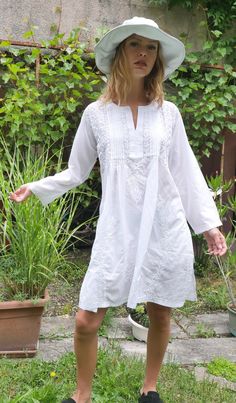 COMFORTABLE white beach dress with handmade cotton embroidery is very easy to wear. this super soft cotton is very pleasant especially in summer! for a beach outing with a swimsuit, by the pool, in the evening for a restaurant with jeans or shorts! .. VERSATILE soft 100% cotton white dress is very popular beach tunic for lazy days in your house, to go shopping or even for a party.. the embroidery is incredible. it is an elegant piece, which requires a unique know-how. TIMELESS classic casual wom White Cotton Tunic With Floral Embroidery, Beach Tunic With Chikankari Embroidery, Beach Tunic Dress With Chikankari Embroidery, Casual Cotton Embroidered Beach Dress, Chikankari Embroidered Tunic Dress For Beach, Spring Beach Tunic With Chikankari Embroidery, Summer Cotton Embroidered Dress For Beach, Summer Cotton Dress With Chikankari Embroidery, Beach Cotton Tunic With Floral Embroidery