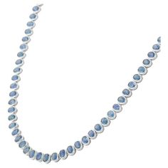 This is part of Chairish’s Fine Jewelry assortment.  Blue Sapphire Necklace in 18K Gold studded with oval cut sapphire pieces. Accessorize your look with this elegant blue sapphire beaded necklace. This stunning piece of jewelry instantly elevates a casual look or dressy outfit. Comfortable and easy to wear, it is just as exquisite worn alone or layered with other charms for a modern fashion statement.  PRODUCT DETAILS :-  > Material - 18K Solid White Gold  > Gemstone - Blue Sapphire  > Gemstone Gold Gemstone Necklace, Blue Sapphire Necklace, Blue Sapphire Gemstone, White Gold Sapphire, Sapphire Wedding, Modern Necklaces, Tennis Necklace, Sapphire Necklace, Sapphire Gemstone