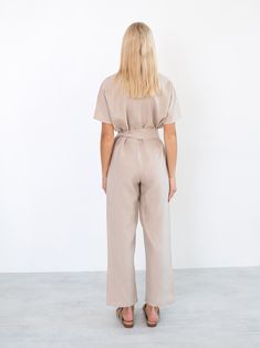 "AURORA is a short sleeve jumpsuit with belt. DETAILS - Wrap style top - Dolman sleeves - Self tie belt - 100% lightweight European linen fabric - Cut and sewn to order just for you in our studio COLOR - Beige, you can also choose other colors above - Fabric samples are available here https://www.etsy.com/listing/586569696/linen-fabric-samples SIZING & FIT - Fits true to size - Inseam is approximately 28.5 inches / 72 cm - Bust is approximately 21 inches / 49.5 cm - Waist is approximately 18 Chic Belted Short Sleeve Jumpsuit, Summer Workwear Belted Jumpsuits And Rompers, Chic Belted Jumpsuit With Short Sleeves, Chic Belted Short Sleeve Jumpsuits And Rompers, Summer Workwear Jumpsuits And Rompers With Belt, Chic Belted Jumpsuits And Rompers With Short Sleeves, High Waist Belted Jumpsuits For Workwear, Summer Workwear Jumpsuits With Short Sleeves, Summer Beige Belted Jumpsuits And Rompers