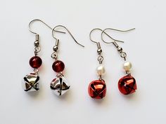 Two different styles of jingle bell earring! Shiny red or silver jingle bells with matching beads. I paired pearl beads with the red bells and dark red glass beads for the silver. Wire Christmas Earrings, Jingle Bell Earrings, Bell Earring, Holiday Earrings Diy, Christmas Jewelry Ideas, Odd Jewelry, Jingle Bell Crafts, Xmas Earrings, Diy Wire Jewelry Rings