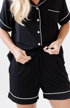 These comfy, stretchy and totally breathable pajamas feature a button-up top and drawstring shorts. Top has notched collar; short sleeves 95% viscose, 5% spandex Machine wash, tumble dry Imported Stretch Short Sleeve Sleepwear For Lounging, Stretch Short Sleeve Sleepwear, Stretch Sleepwear For Lounging With Short Sleeves, Black Short Sleeve Sleepwear For Pajama Party, Black Summer Sleepwear With Elastic Waistband, Black Casual Pajama Shorts For Pajama Party, Black Sleepwear With Elastic Waistband For Summer, Stretch Black Pajama Shorts For Loungewear, Black Stretch Pajama Shorts For Loungewear