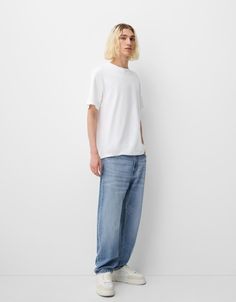 Straight fit ’90s jeans - Jeans - Men | Bershka Trendy Relaxed Fit Cropped Jeans For Streetwear, Summer Streetwear Cropped Straight Leg Jeans, Relaxed Fit Rigid Denim Cropped Jeans For Streetwear, Tapered Leg Jeans For Streetwear, Relaxed Fit Cropped Jeans In Rigid Denim For Streetwear, Urban Style Relaxed Fit Flare Jeans, Streetwear Tapered Leg Flare Jeans With Five Pockets, Casual Rigid Denim Cargo Jeans With Relaxed Fit, Casual Cargo Jeans In Rigid Denim With Relaxed Fit