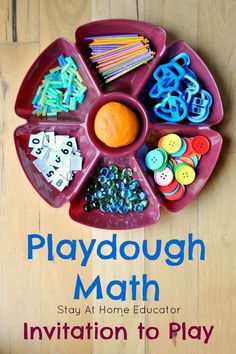 a playdough math tray with buttons and magnets