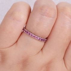 Featuring a series of beautiful pink tourmaline stones, this 10k white gold eternity ring offers a fun and gorgeous touch to any outfit. Featuring a series of beautiful pink tourmaline stones, this 10k white gold eternity ring offers a fun and gorgeous touch to any outfit.Click on this JEWELRY & WATCHES GUIDE to learn about fit, styles, materials and more! Width: 2.5 mm Metal: 10k white gold Plating: rhodium Finish: polished Packaging: boxedSTONE DETAILS Stone type: pink tourmaline Total weight: Pink Round Cut Ruby Ring In Fine Jewelry Style, Fine Jewelry Pink Ruby Ring With Round Cut, Fine Jewelry Pink Round Cut Ruby Ring, Pink Ruby Ring With Prong Setting, Stackable Pink Sapphire Jewelry In Pink, Elegant Pink Jewelry With Channel Set, Pink Half Eternity Jewelry Gift, Pink Round Cut Ruby Ring, Elegant Pink Channel Set Jewelry