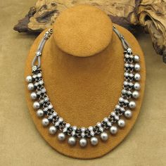 This vintage necklace is a stunning piece of handcrafted jewelry that is sure to catch the eye of anyone who sees it. Made from high-quality sterling silver, this necklace boasts an intricate beaded design that is both unique and timeless. The necklace measures 18 1/4" from end to end. The beads measure 11mm tall by 11mm wide. The artist's hallmark (RA) is stamped on the necklace. This necklace is perfect for anyone who loves vintage and antique jewelry. The silver color and unique design make i Handmade Beaded Necklace, Antique Jewelry Necklace, Handmade Beaded Necklaces, Vintage Watches, Vintage Necklace, Vintage Sterling Silver, Handcrafted Jewelry, Antique Jewelry, Silver Color